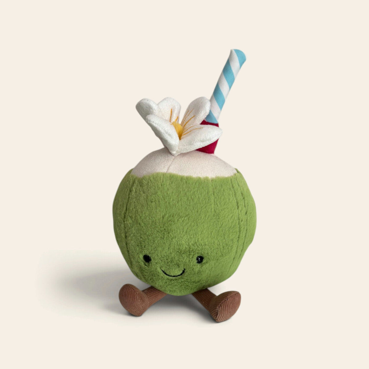 Amuseables Aruba Coconut A2CND: a green plush coconut toy with a white top, a blue and white striped straw, a white flower, a smiling face and brown corduroy legs