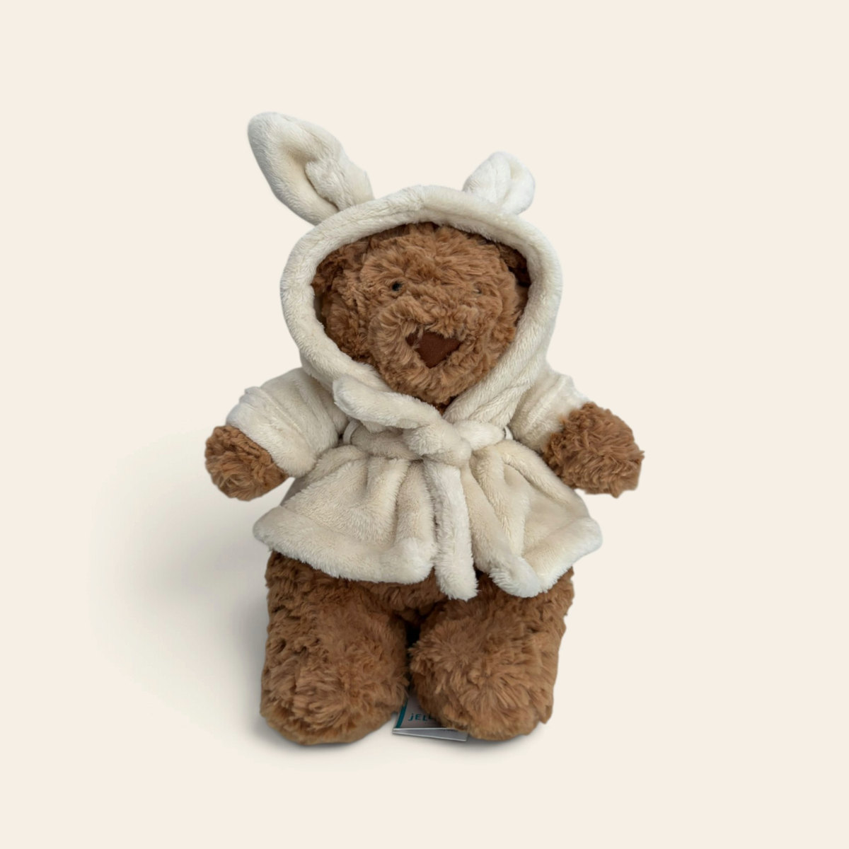 Bartholomew Bear ‘Bathrobe’ BARM2BR: a brown fluffy plush teddy bear wearing a cream hooded bathrobe with bunny ears