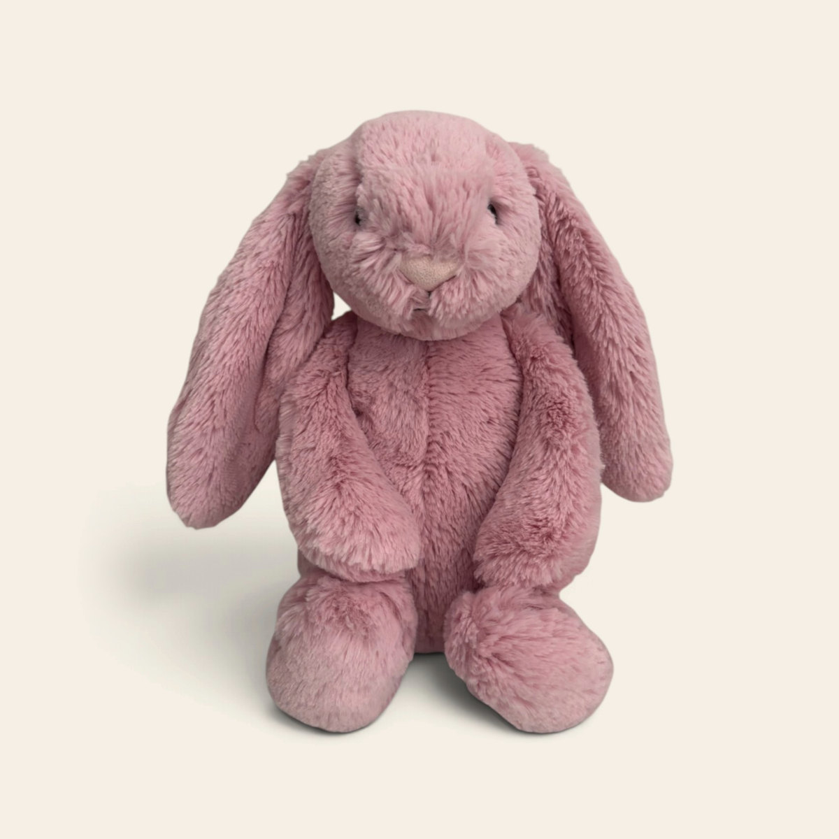 Bashful Tulip Pink Bunny BAS3BTP: a deep pink plush bunny with long floppy ears and a pink nose, sitting