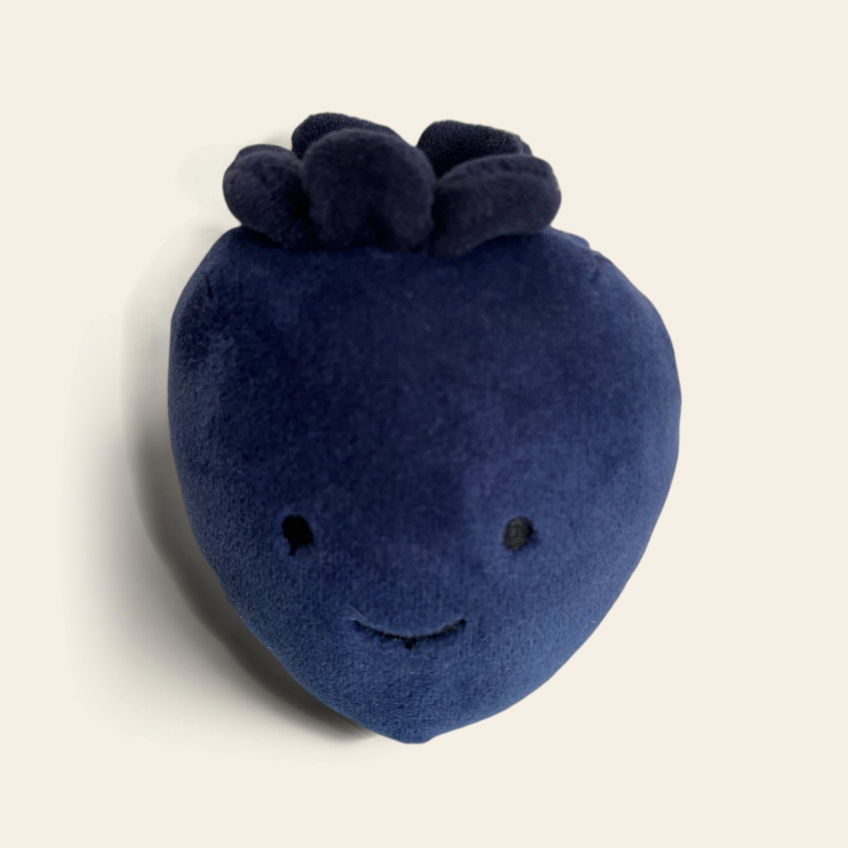 Fabulous Fruit Blueberry FABF6BB: a dark navy blue velvety plush blueberry with a frilled top and a smiling face