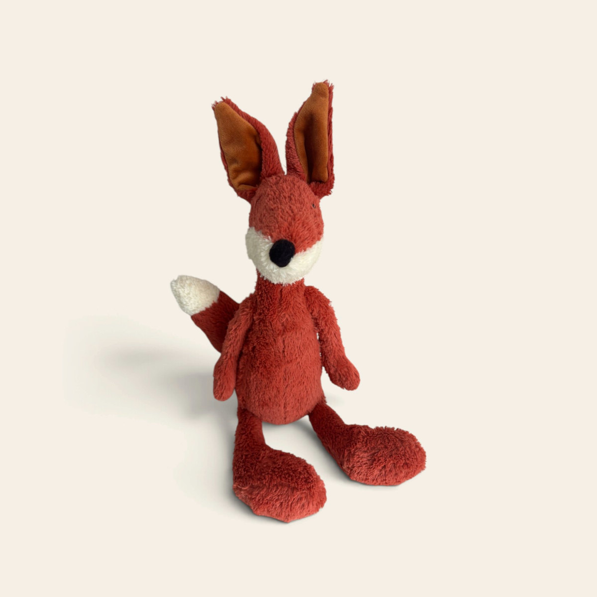 Harkle Fox HARK3F: a slim orange plush fox with tall pointed ears, a cream face and chest and long dangly legs, sitting