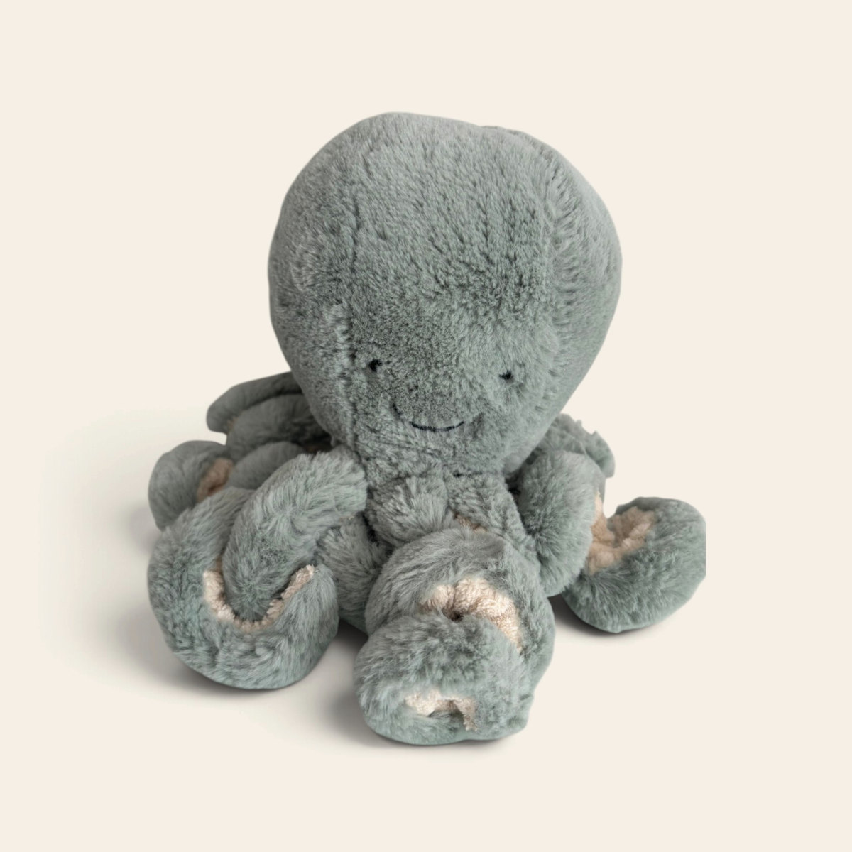 Odell Octopus OD2OC: a sea green plush octopus with curly tentacles and a smiling face