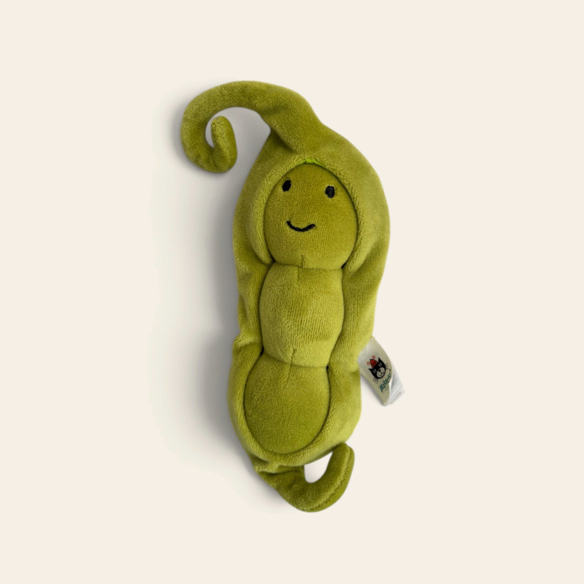Amuseables Pea in a Pod A2PPOD: a green plush pea pod toy with a curled stalk and a smiling pea face