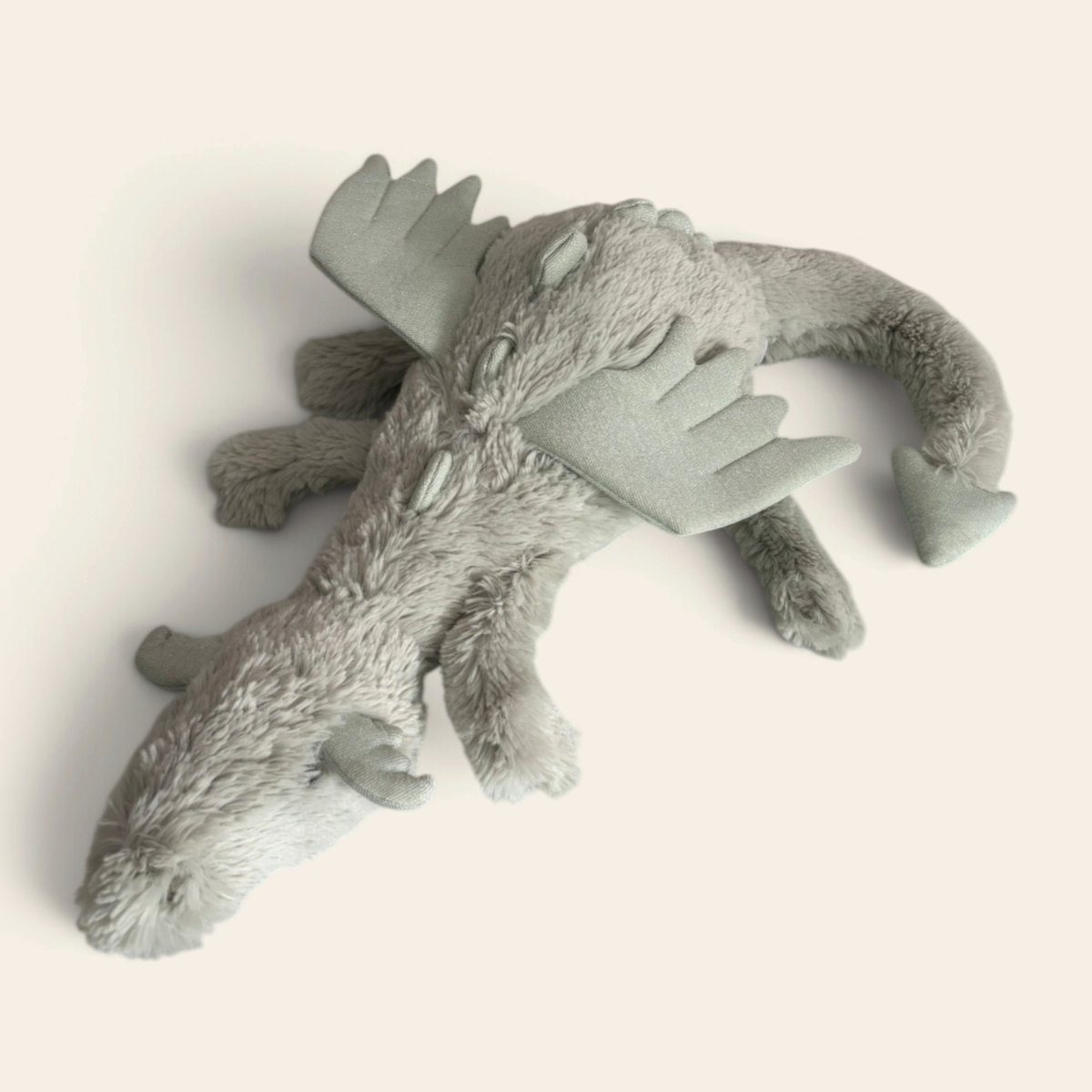 Sage Dragon SAGE2DD: a pale sage green plush dragon with soft wings and spines, lying down