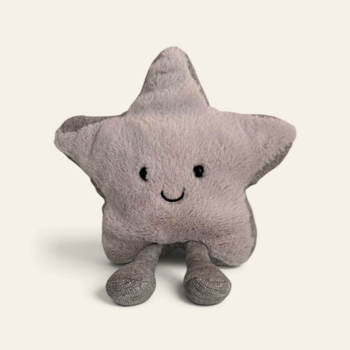 Amuseables Silver Star A6STA: a silvery grey plush star toy with a smiling face and grey corduroy legs